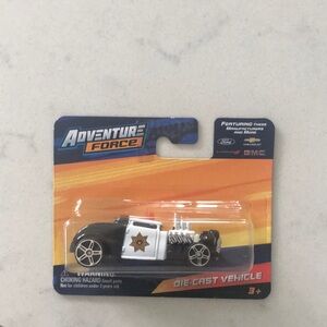 Black and White Die-Cast Police Car Knuckle Dragger